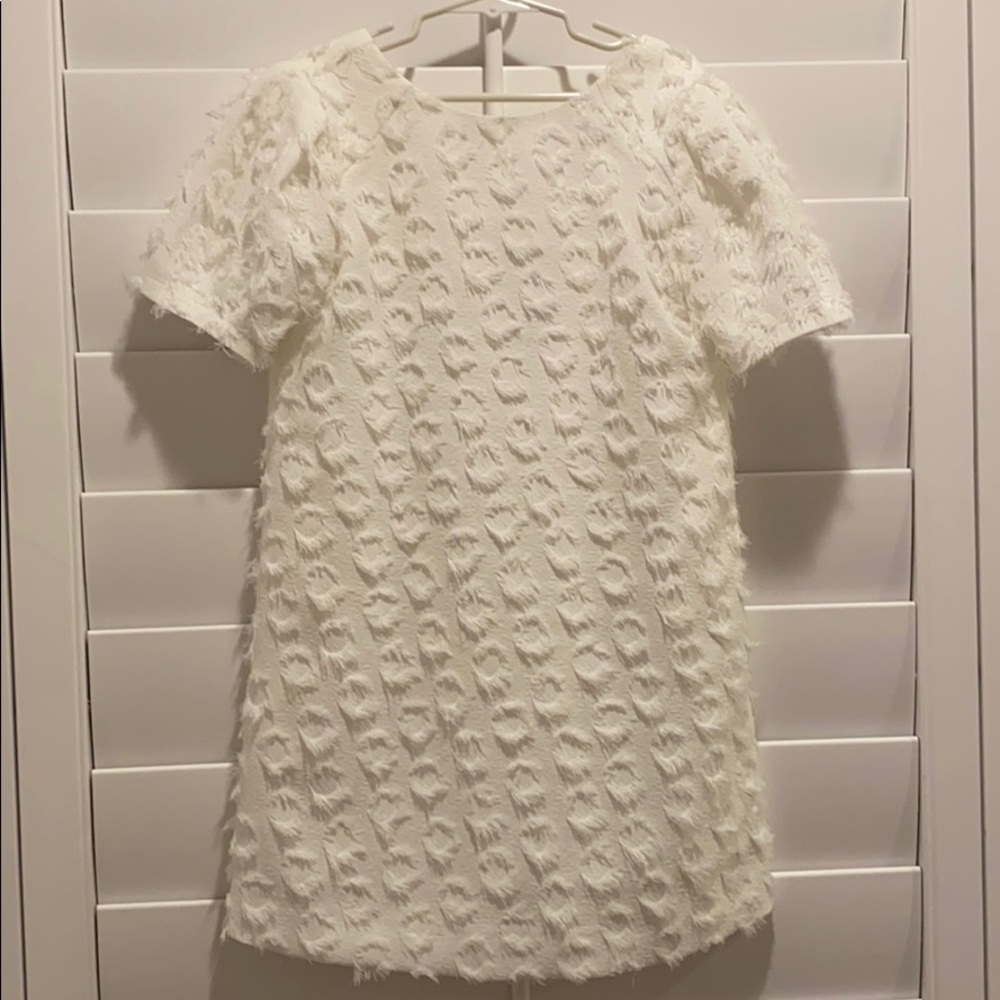 White shift dress with a twist.